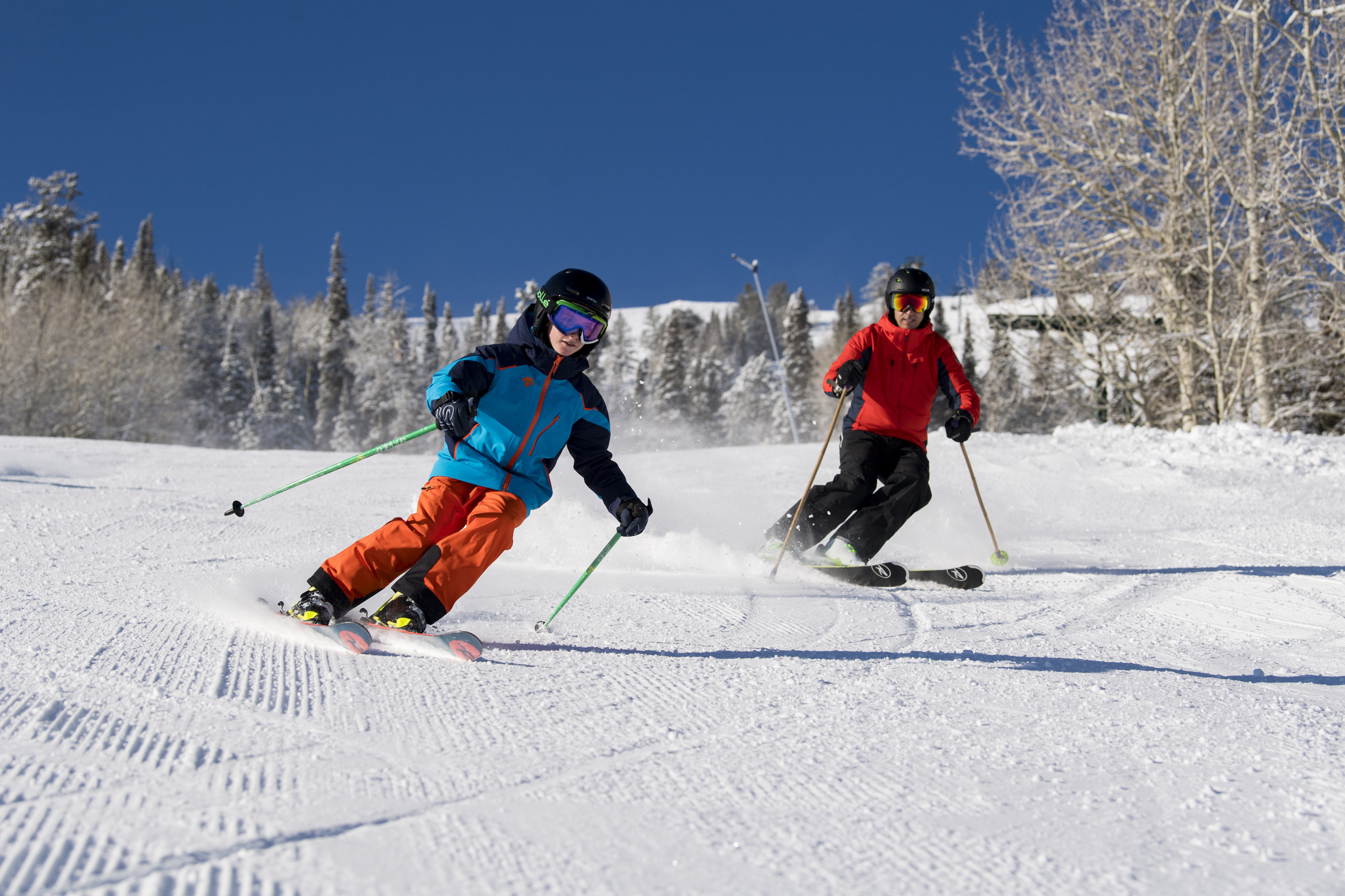 Family skiing on sunny day at Deer Valley Resort