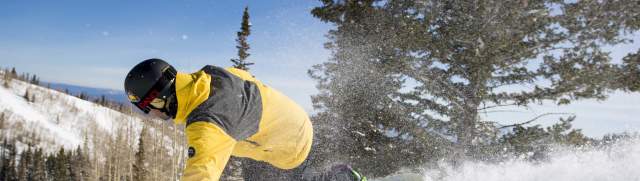 Snowboarder on groomer at Park City Mountain