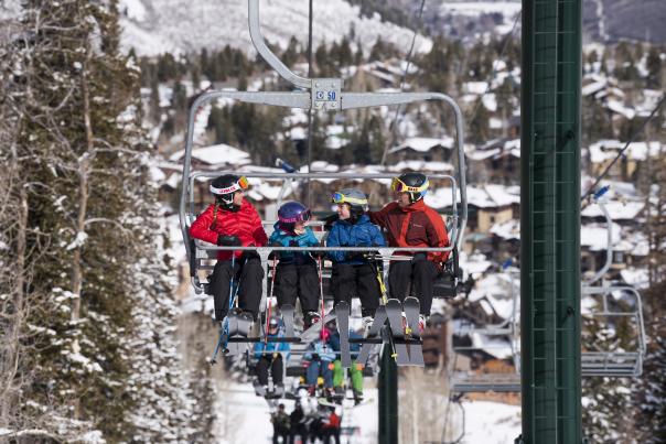 Family on chairlift while skiing at Deer Valley Resort