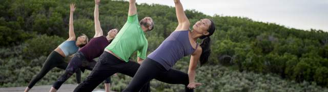 Group doing yoga outdoors at Blue Sky Ranch