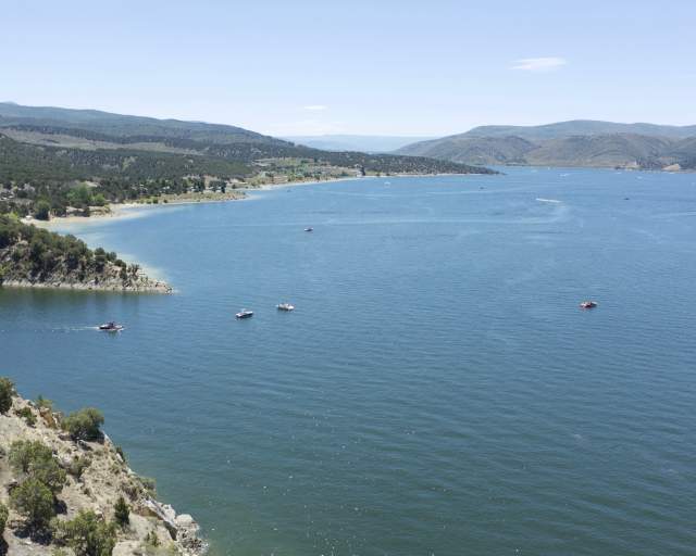 Rockport Reservoir during the summer, activities include boating and wake boarding.