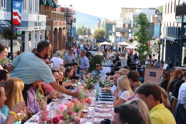 photo of people sitting at a table on Main Street Park City at the Savor the Summit event in 2012