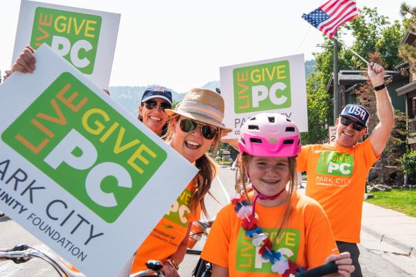 Group of People Holding Live PC Give PC signs