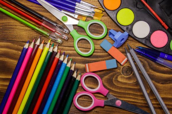 Colorful art supplies laid out on a table