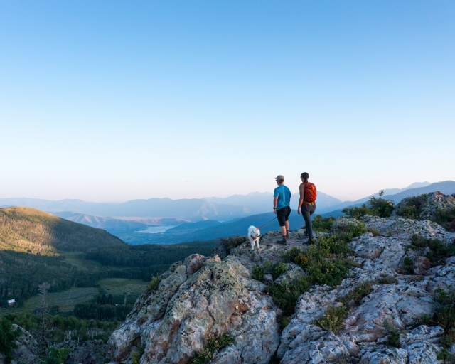 Couple enjoying a scenic view from top of mountain