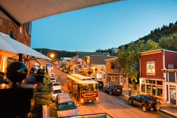 Trolly driving down Main street at dusk