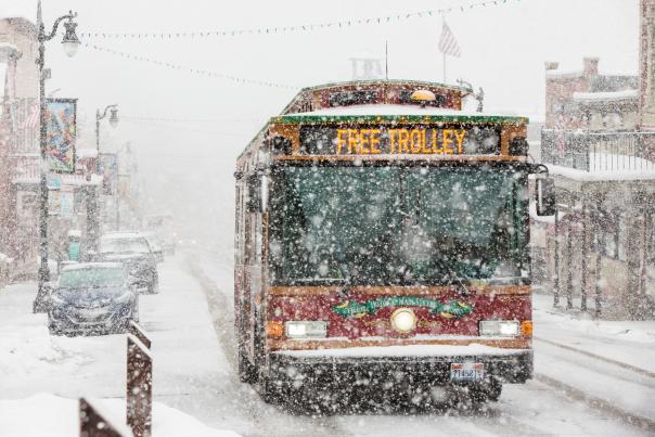 Free Trolley driving up Historic Main Street in a snow storm