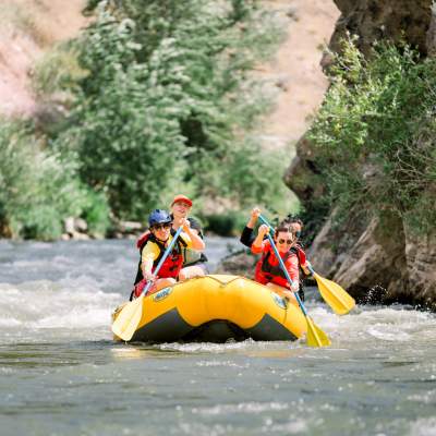 Group of people white water rafting