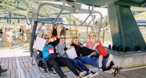 Group getting on a chairlift in the summer