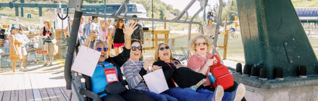 Group getting on a chairlift in the summer