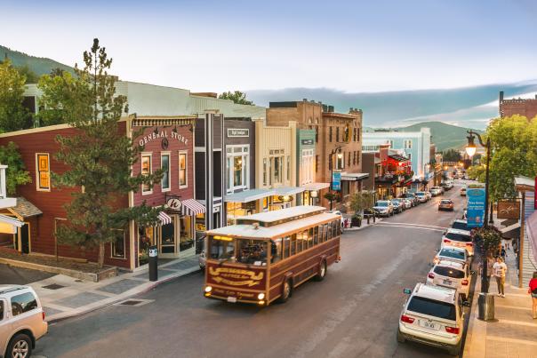 Trolley driving up Historic Main Street in summer