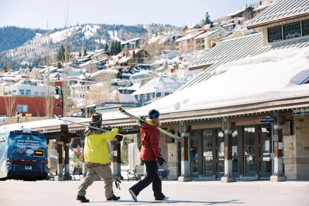 Skiers walking by old town transit station