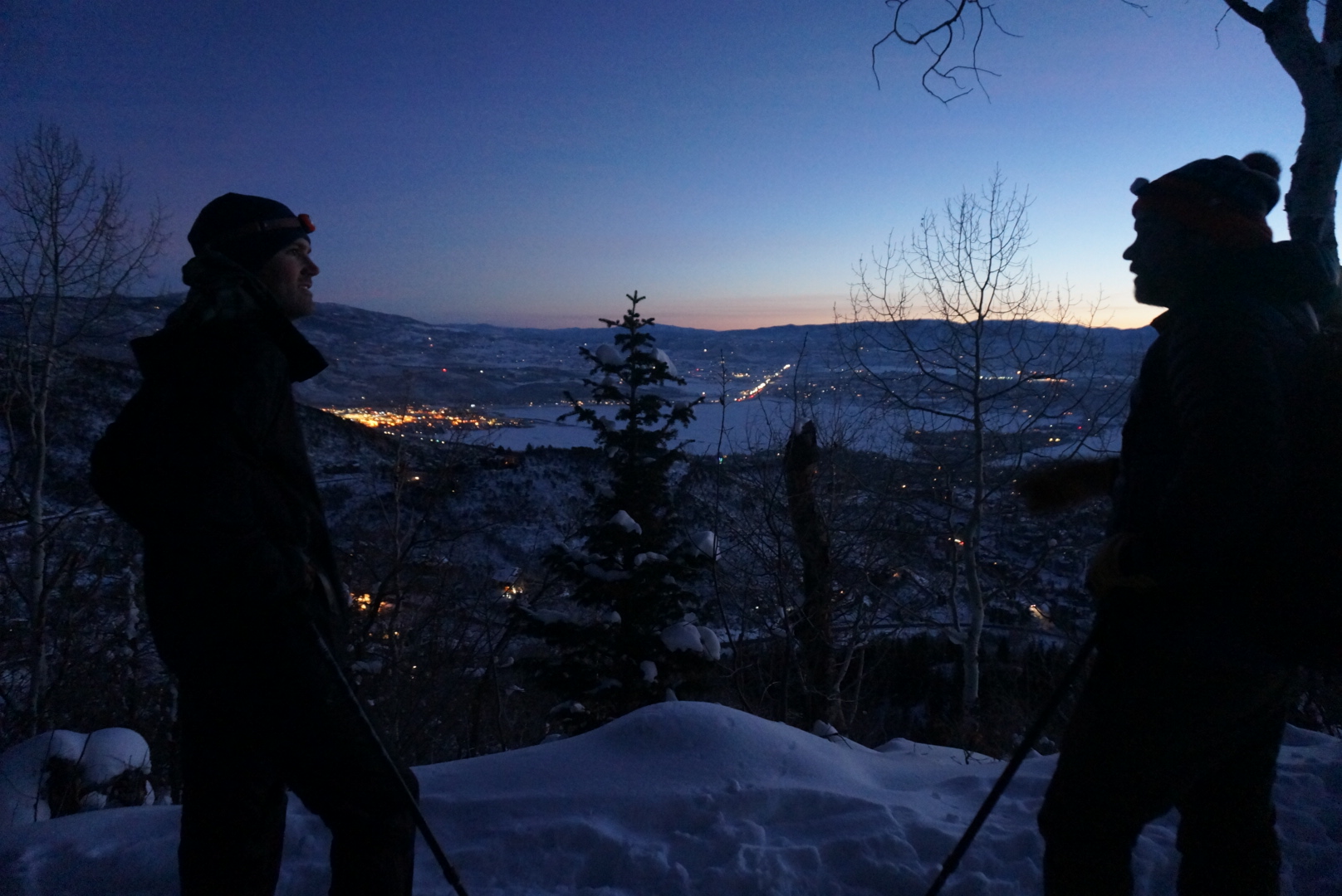 Two people in the dark waiting for the sun to rise