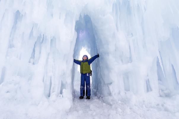 Boy standing in Ice Castle hallway