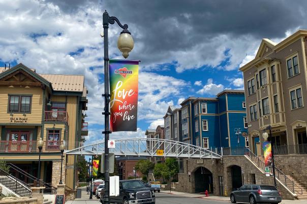 Rainbow sign that reads Love where you live