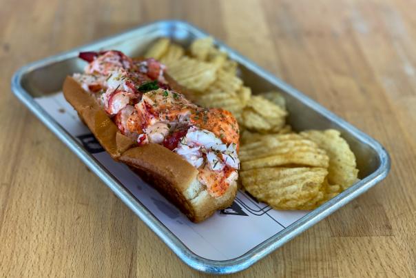 Lobster Roll and chips on a tray