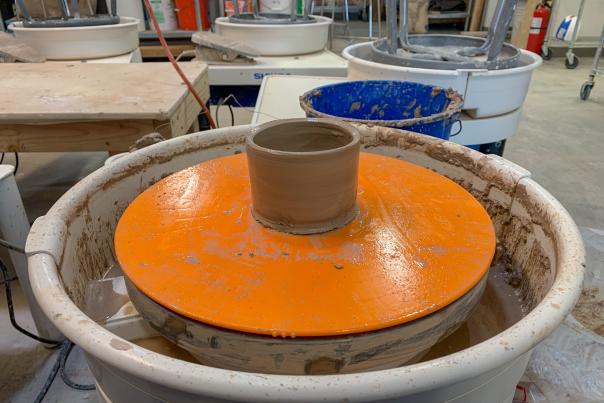 Wet clay Cup on Potter's wheel