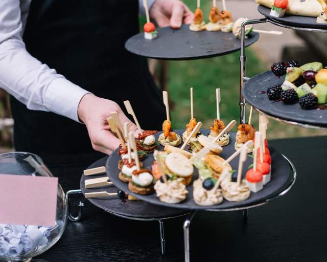 person holding tray of food