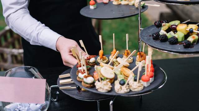 person holding tray of food