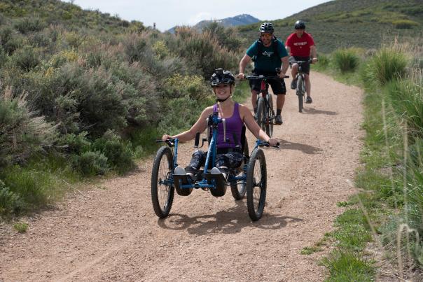 Women riding in a 4 cross mountain bike