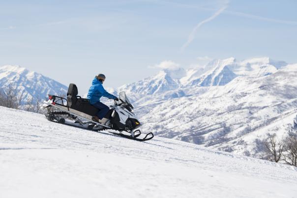 Snowmobile on Ridge with Timpanogos in the background