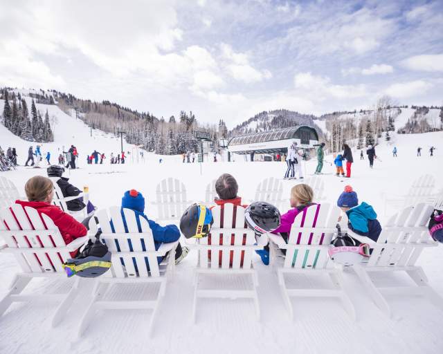 Family sitting at Ski Beach at Deer Valley Resort