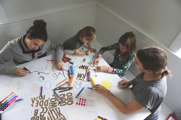 kids coloring at a table