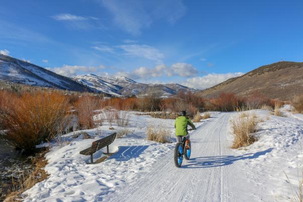 Person riding an Electric Fat Tire Bike on snow covered bike path