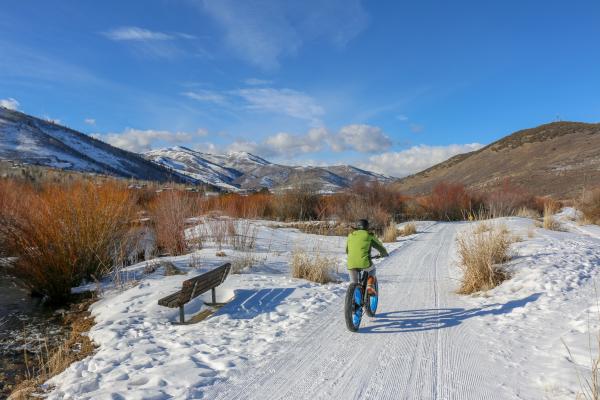 Person riding an Electric Fat Tire Bike on snow covered bike path