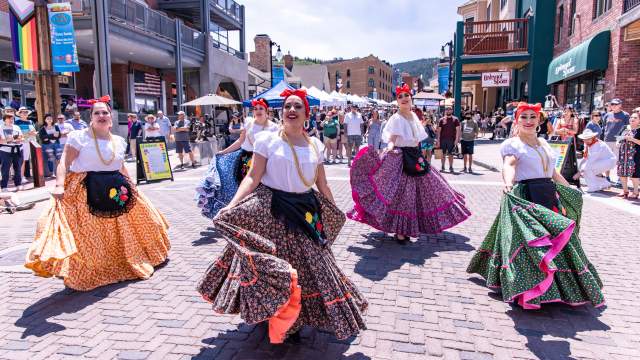 Women dancing for the Latino Arts Festival parade