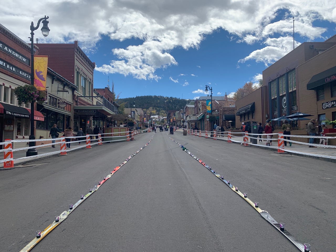 Shot skis laying in the road