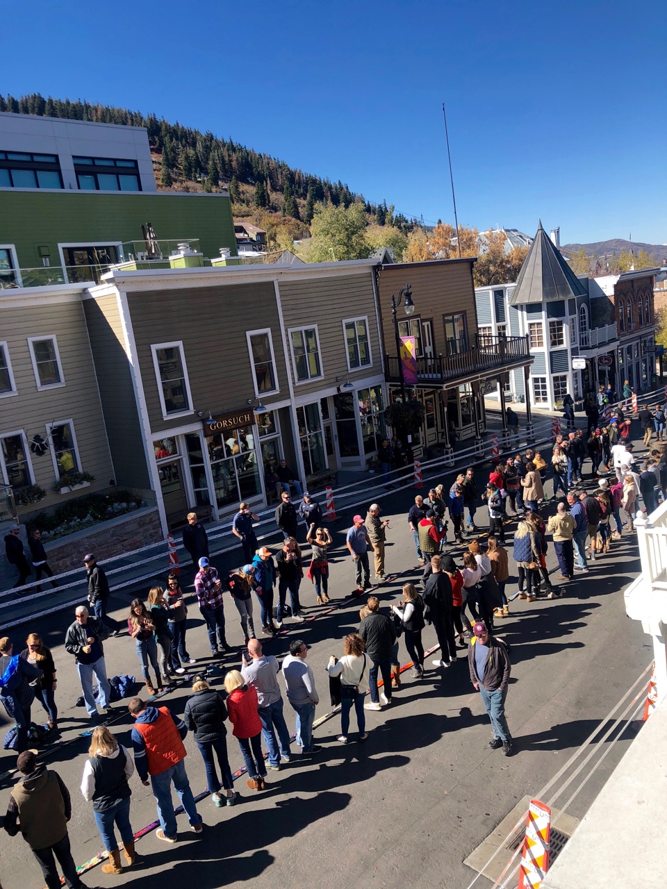 People line up for a shot ski in the road