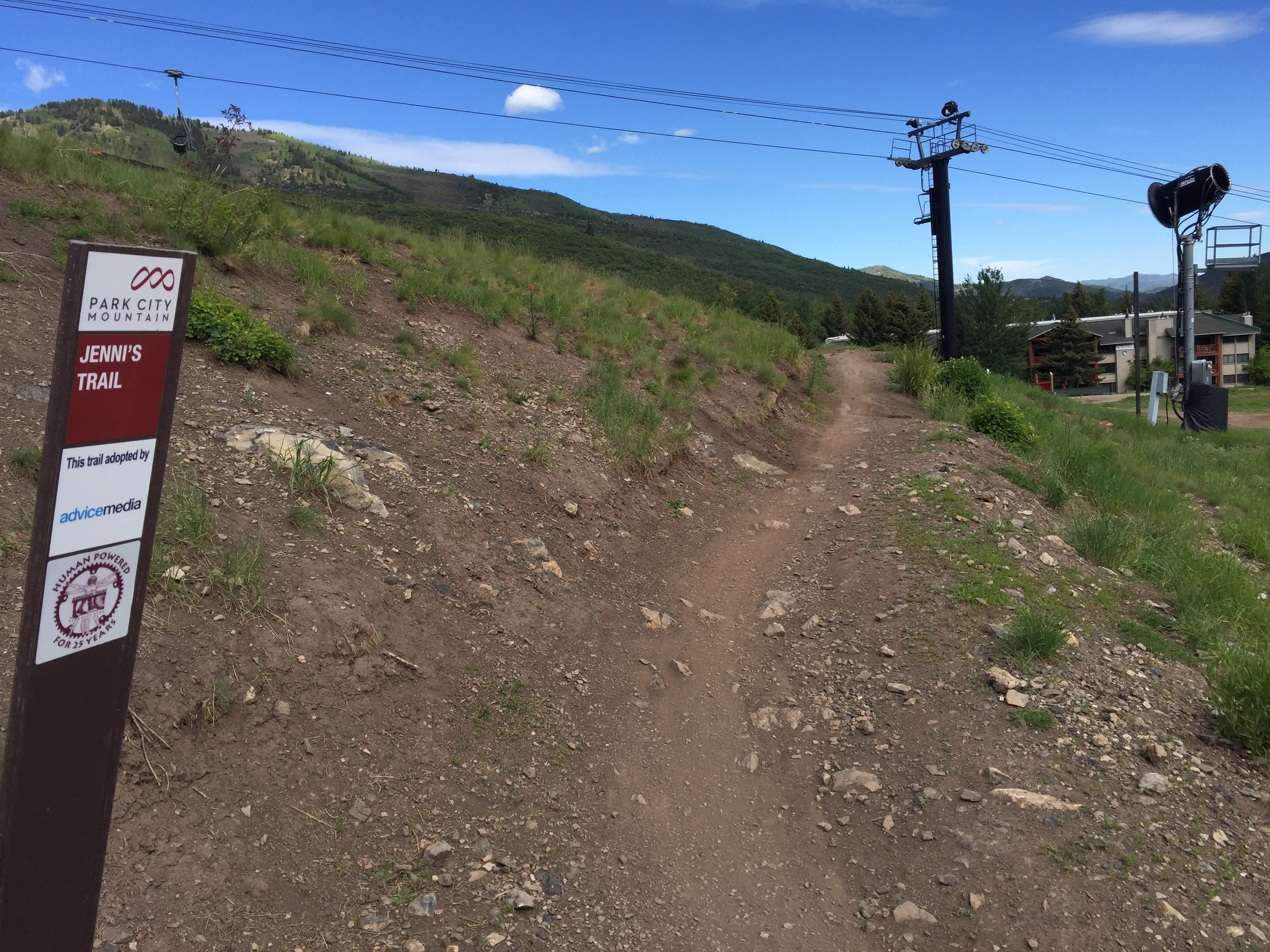 Trail Head Sign with trail in background