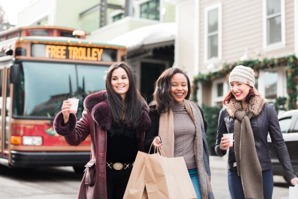 three women walking down main street