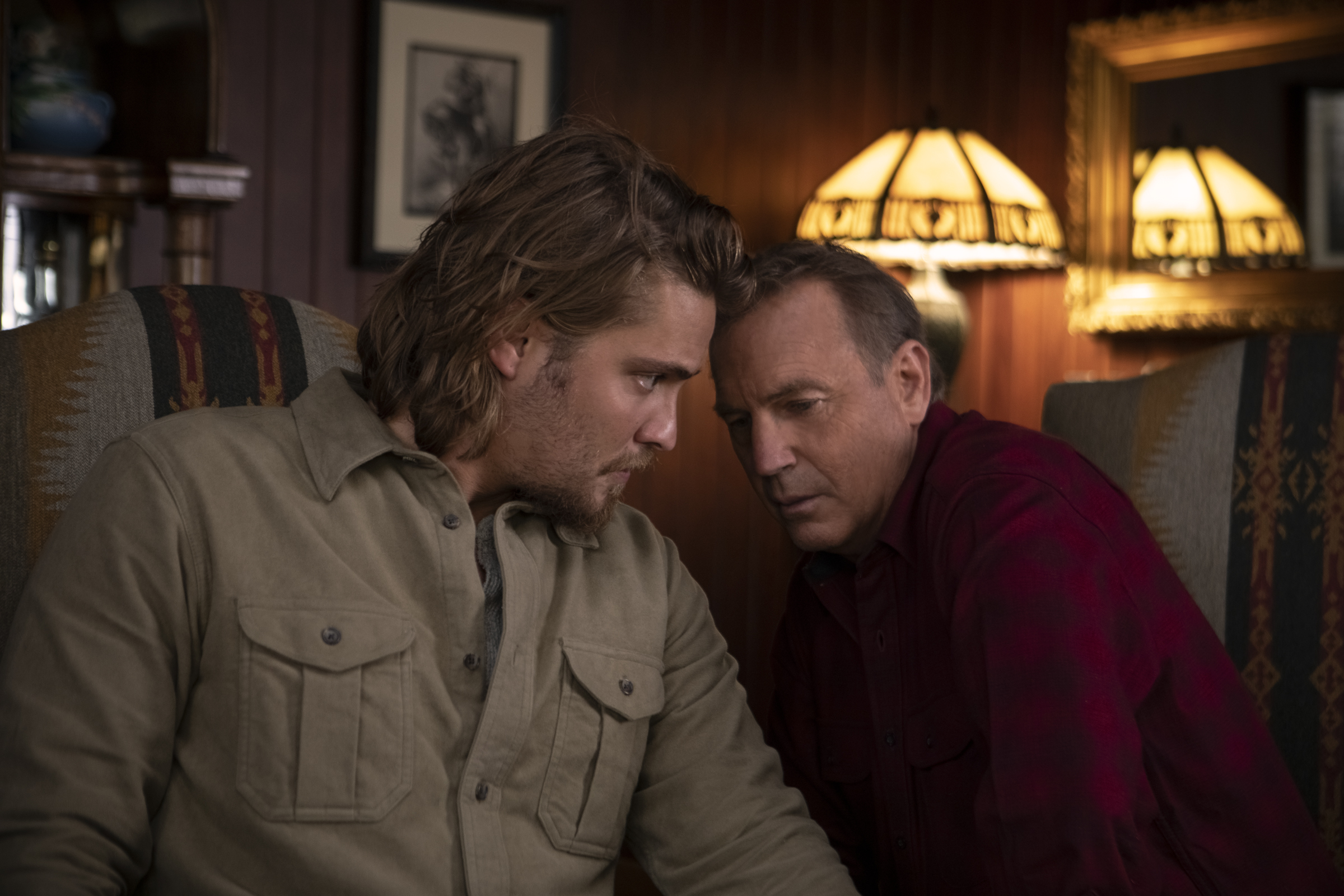 Two actors talking on the set of Yellowstone